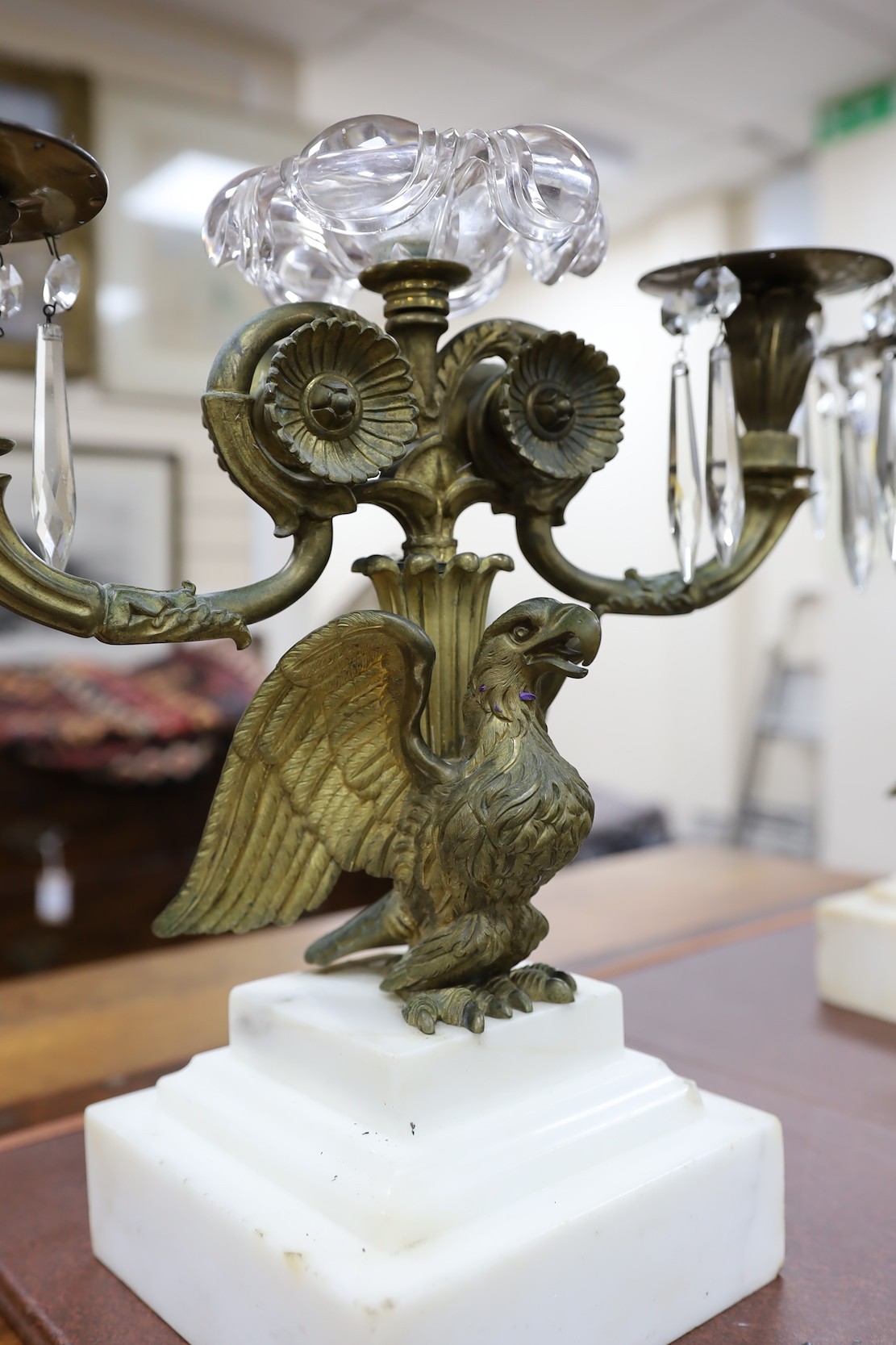 A pair of 19th century eagle two branch candelabra, 34cms high x 3cms wide